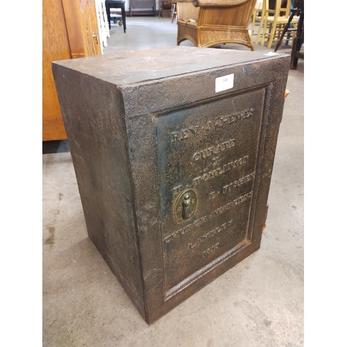 346 - A small 19th Century cast iron safe, inscribed; Rev. J Hewes, Curate, T. Tomlinson, E. Fisher, Churc... 