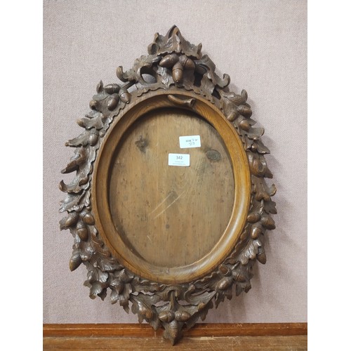 342 - A late 19th Century carved oak Black Forest picture/mirror frame