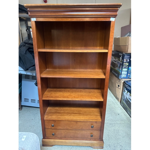 1469 - A cherry wood bookcase with drawers