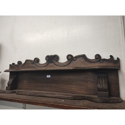 335 - A 19th Century carved oak wall shelf