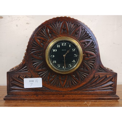 321 - An Edward VII carved oak 8 day mantel clock