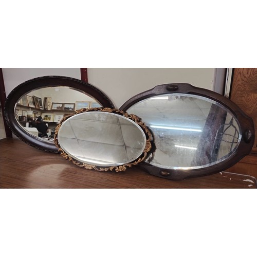 324 - A mahogany oval framed mirror and two others