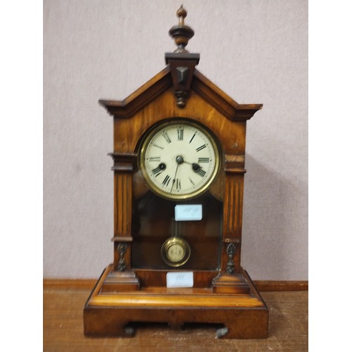 332 - A carved beech mantle clock