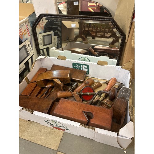 311A - A collection of vintage wood planes and an oak framed mirror