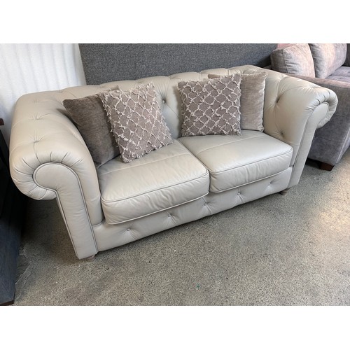 1461 - A stone leather Chesterfield  two seater sofa