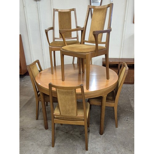 17 - A Nathan teak circular dining table and six chairs