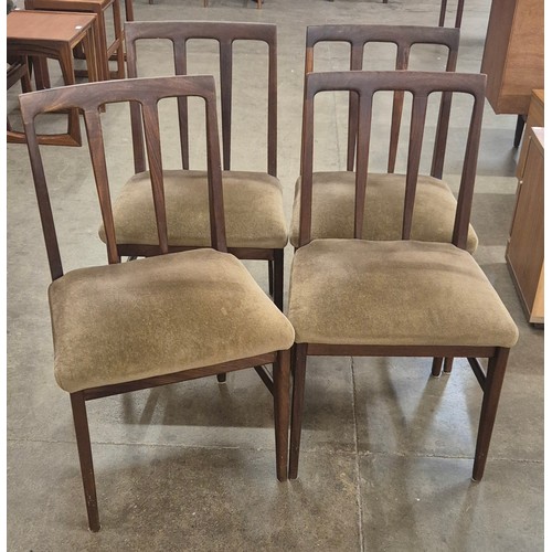 110A - A Younger teak extending dining table and four chairs, designed by John Herbert