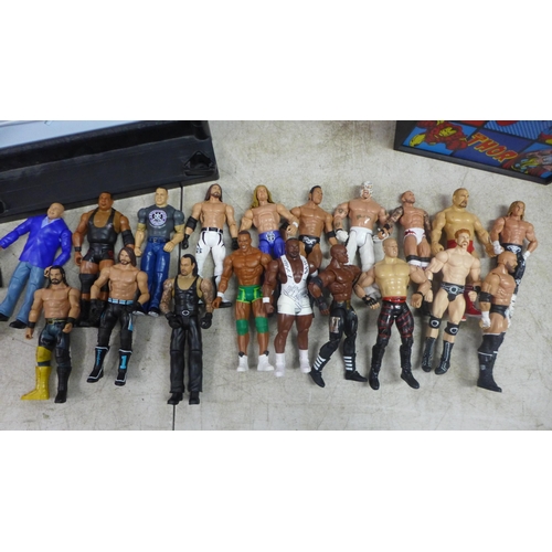 2051 - 19 WWE figures, 2 WWE rings, a Marvel light box and an Ironman poster