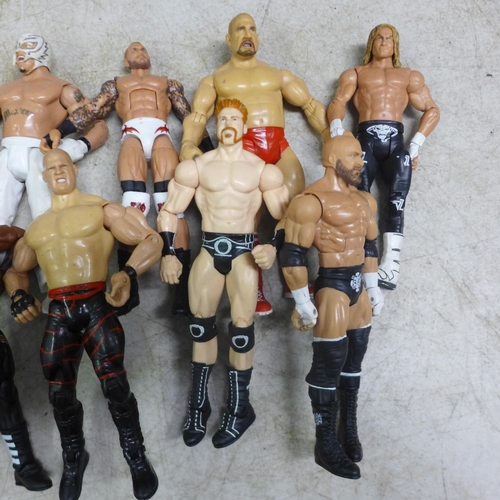 2051 - 19 WWE figures, 2 WWE rings, a Marvel light box and an Ironman poster