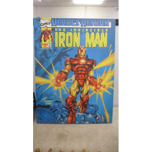 2051 - 19 WWE figures, 2 WWE rings, a Marvel light box and an Ironman poster