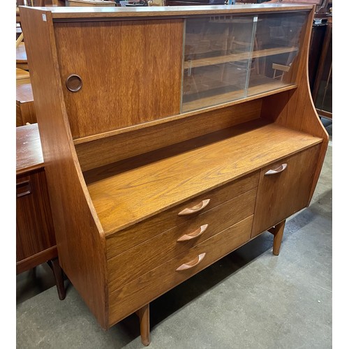 40 - An Avalon teak highboard