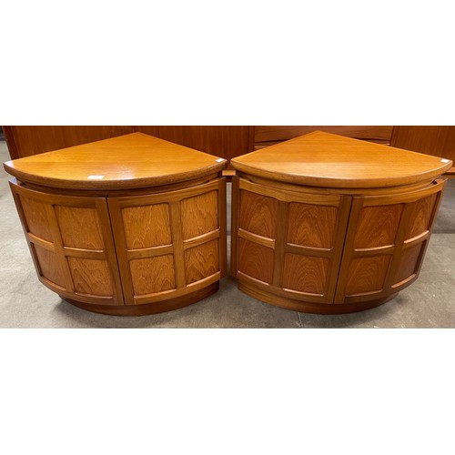 56 - A pair of Nathan teak corner cabinets