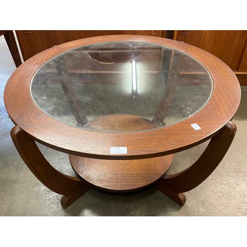 58 - A Stonehill teak and glass topped circular coffee table