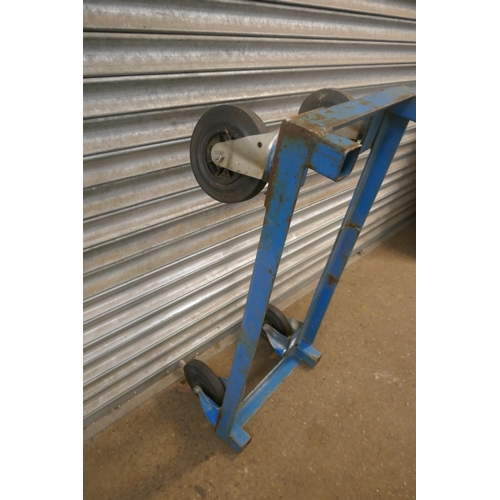 2162 - A large mobile steel frame with rubber tired castors