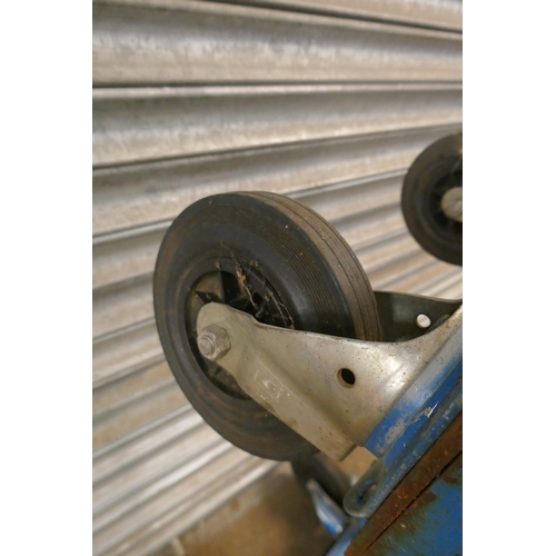 2162 - A large mobile steel frame with rubber tired castors