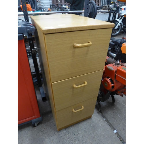 2216 - A three drawer wooden filing cabinet