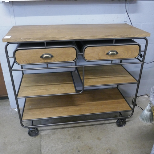 1309 - An industrial style wood and metal two drawer sideboard on wheels