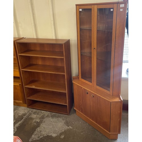 67 - A Turnidge of London teak corner cabinet and a teak open bookcase