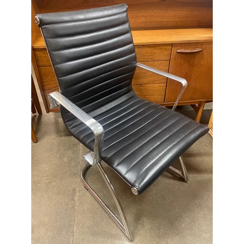 88 - A chrome and black leather cantilever armchair