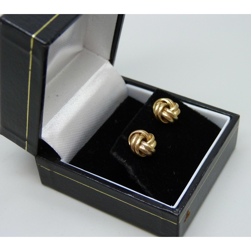 1000 - A pair of 9ct gold knot earrings with butterflies, boxed, 0.5g