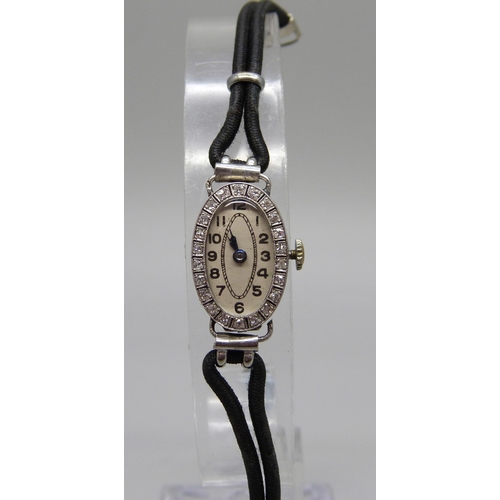 1002 - A lady's platinum and diamond cocktail watch, hinge a/f, case 2cm x 1.3cm