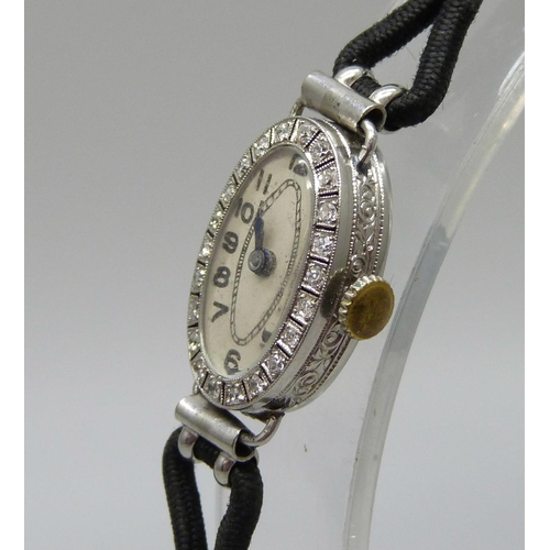 1002 - A lady's platinum and diamond cocktail watch, hinge a/f, case 2cm x 1.3cm