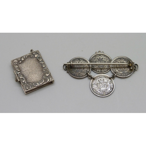 1005 - An Art Nouveau 'Memorable Days' white metal book locket charm, a/f, and a silver American Victorian ... 