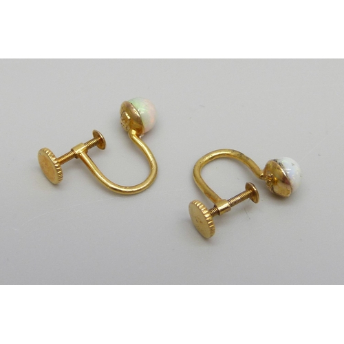 1007 - A pair of 15ct gold and opal screw-back earrings, a/f, 1.7g