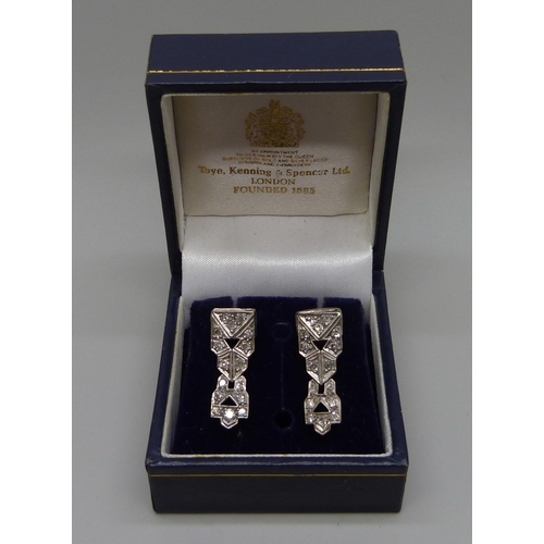 1017 - A pair of white metal Art Deco and diamond set earrings, possibly converted from a wristwatch, boxed... 