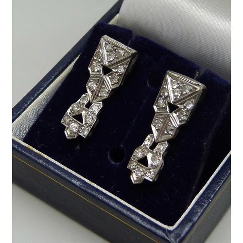 1017 - A pair of white metal Art Deco and diamond set earrings, possibly converted from a wristwatch, boxed... 