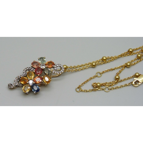 1019 - A silver gilt and multi gem pendant and chain