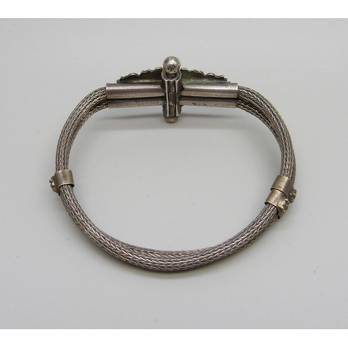 1028 - An Eastern bracelet, tests as silver, 23g