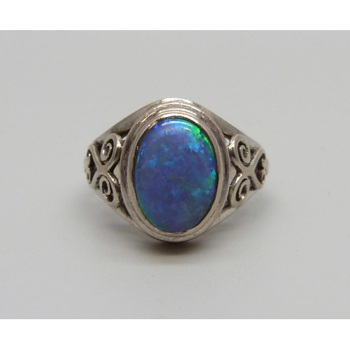 1034 - A white metal and opal ring, L