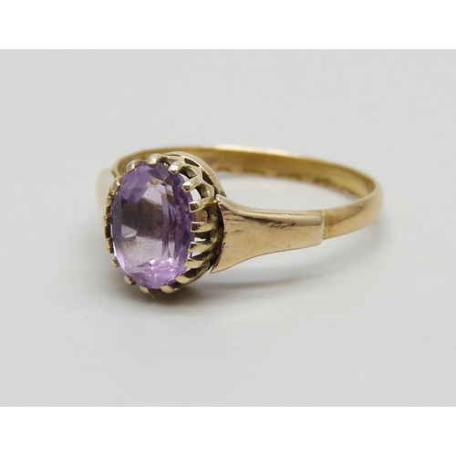 1048 - A yellow metal and amethyst ring marked 22ct, adapted from a wedding band, in a vintage box, 2.5g, O