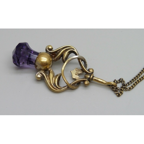 1049 - A gilt Art Nouveau pendant on a silver gilt chain