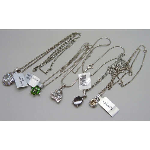 1055 - A collection of pendants including chrome diopside and champagne quartz, 30g