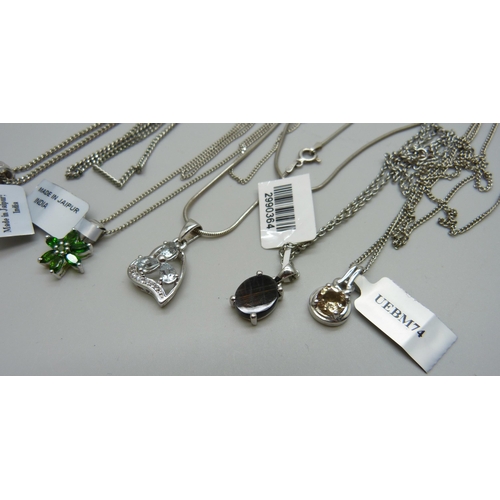 1055 - A collection of pendants including chrome diopside and champagne quartz, 30g