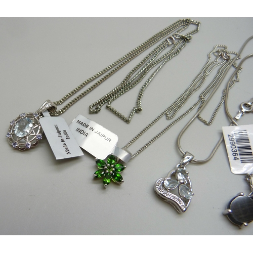 1055 - A collection of pendants including chrome diopside and champagne quartz, 30g