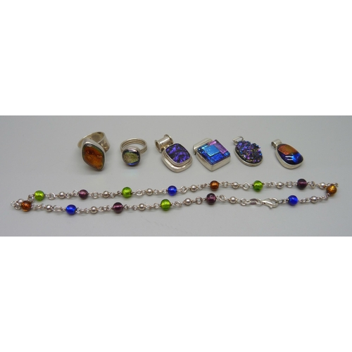 1057 - A collection of silver and dichroic glass rings and pendants, and a foil bead silver necklace, 57g