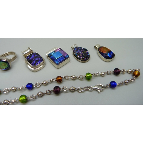 1057 - A collection of silver and dichroic glass rings and pendants, and a foil bead silver necklace, 57g