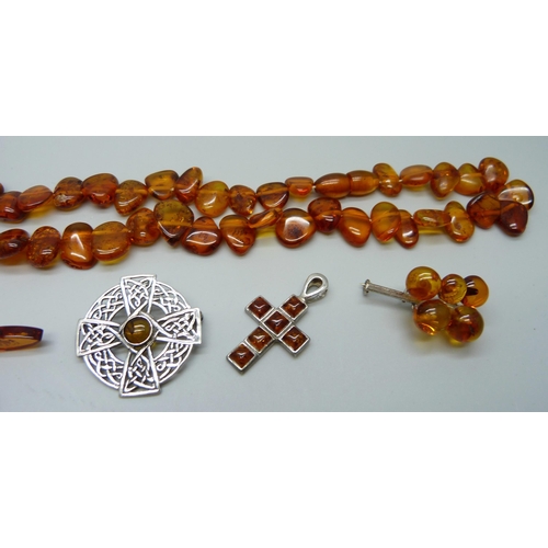 1060 - Amber jewellery including silver set examples, (Celtic brooch clasp a/f)