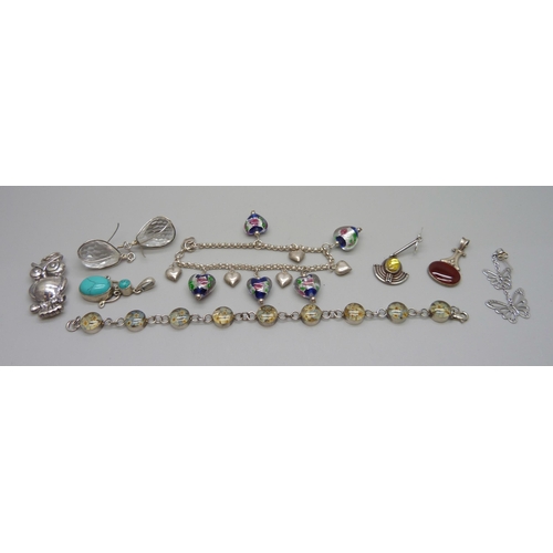 1062 - A collection of silver jewellery including two bracelets, a pair of earrings, three pendants and two... 