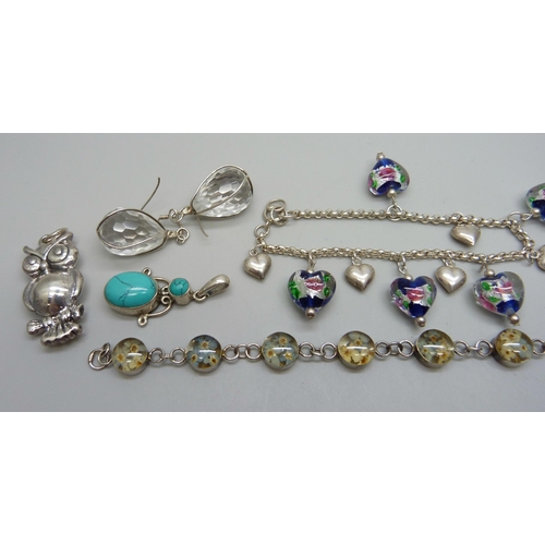 1062 - A collection of silver jewellery including two bracelets, a pair of earrings, three pendants and two... 