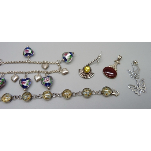 1062 - A collection of silver jewellery including two bracelets, a pair of earrings, three pendants and two... 