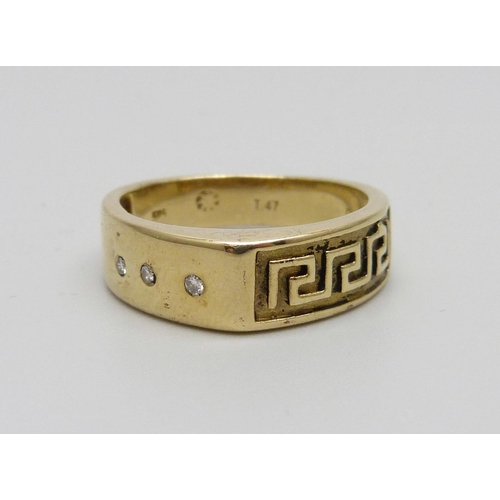 1070 - A 14ct gold Greek key design ring set with three diamonds, 4.5g, N/O