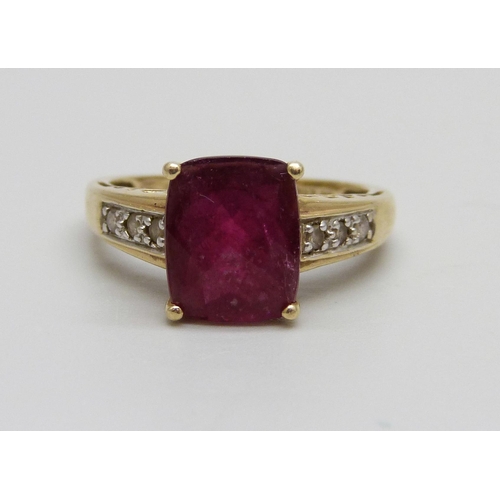 1080 - A 14ct gold ring set with a red stone and diamonds, 3.8g, O/P