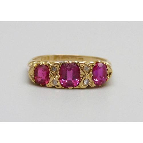 1083 - An 18ct yellow gold diamond and pink stone ring, Birmingham 1912, 3.2g, O/P