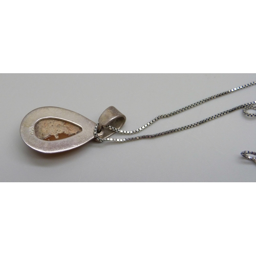 1085 - A .950 silver and opal set pendant on a silver chain, 5.6g