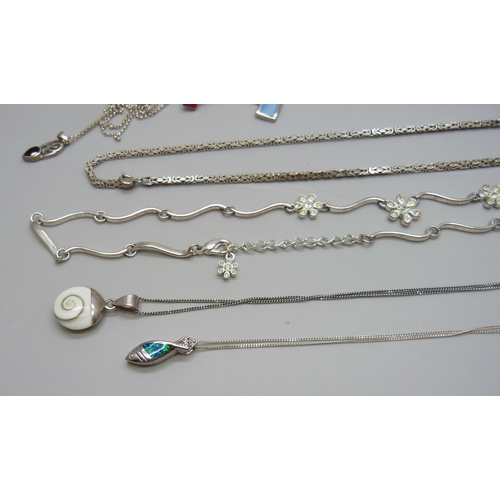 1091 - Four silver pendants and chains, two other silver pendants, a silver neck chain, 39g, and a plated f... 