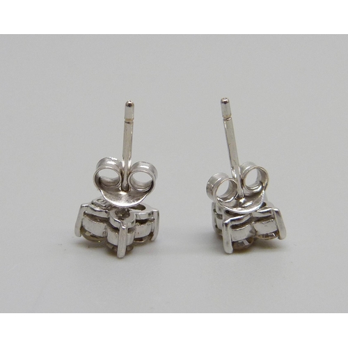 1100 - A pair of 18ct white gold and diamond earrings, 0.5ct total diamond weight, 1.2g, 5mm